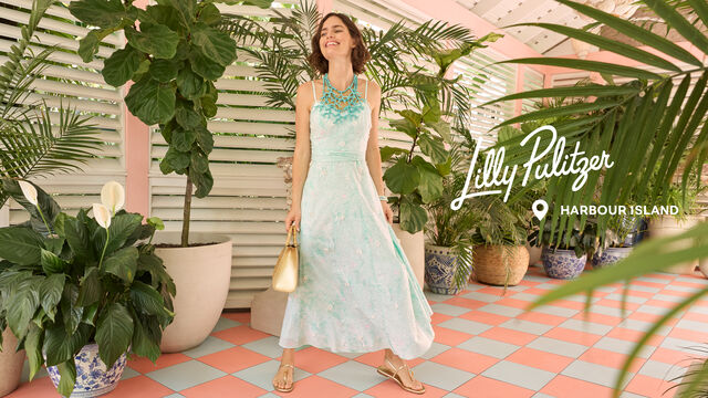 Model in long blue occasion dress